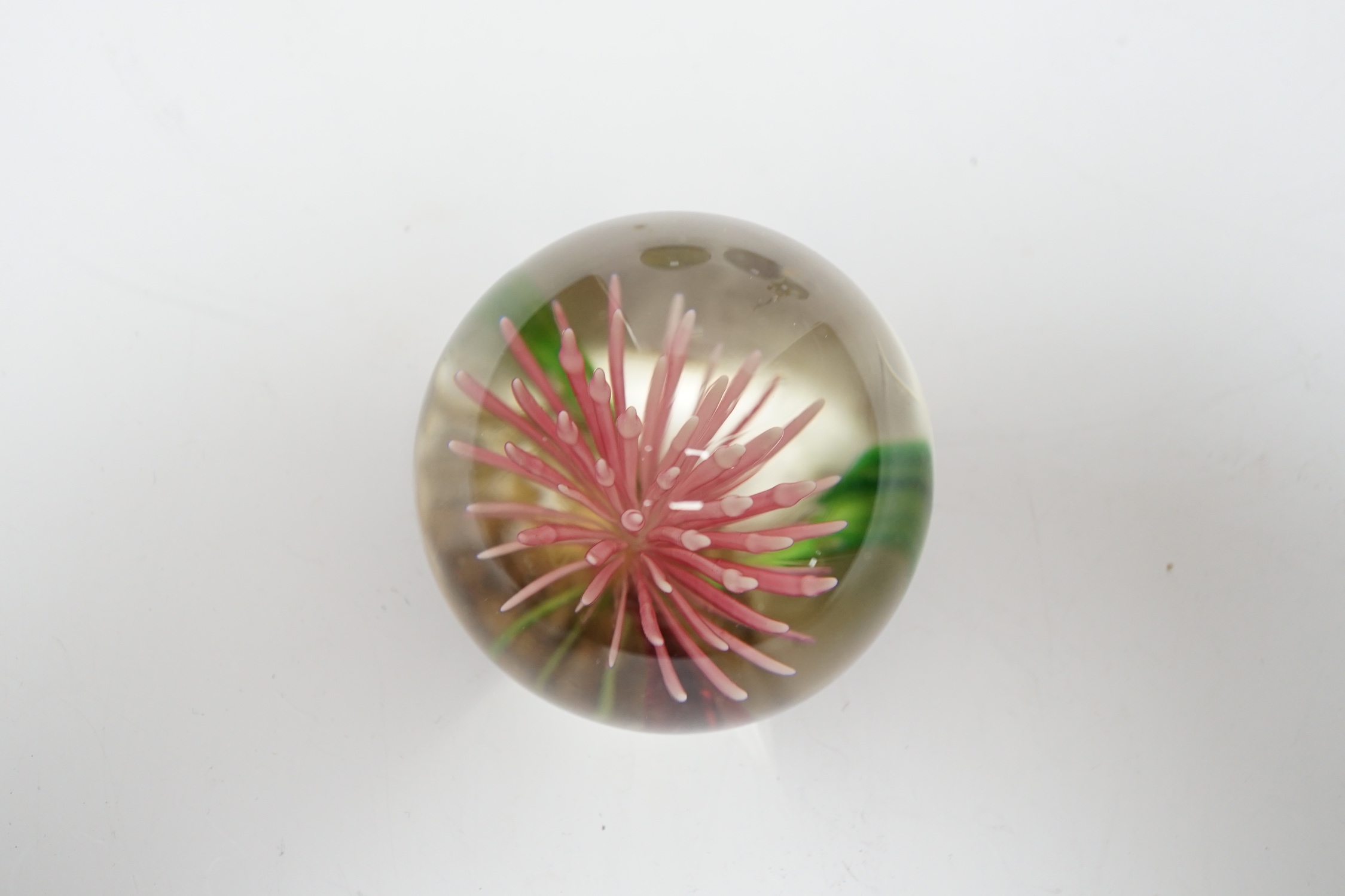 Three Mdina style glass paperweights and a Chinese paperweight (4)